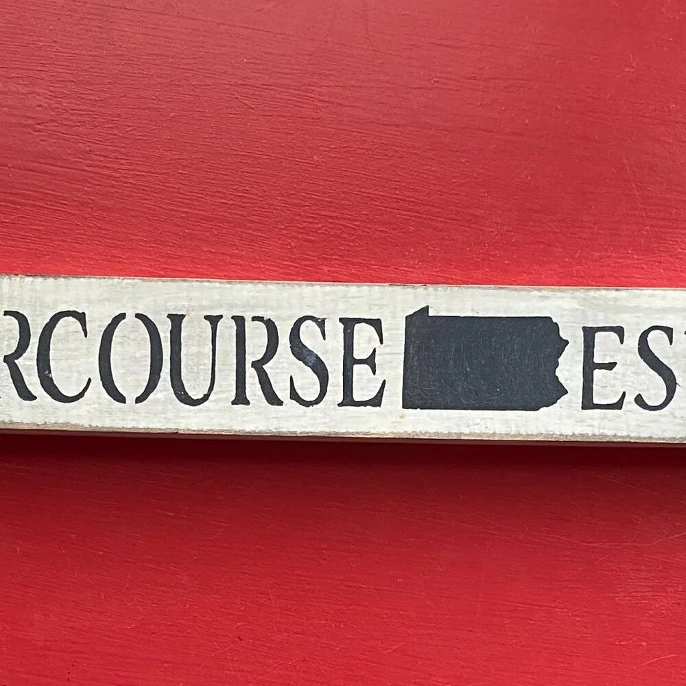Wooden Sign with Black Text